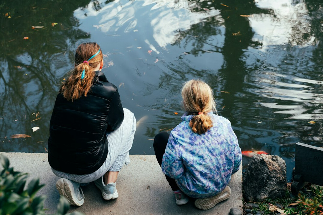 people reflecting in nature